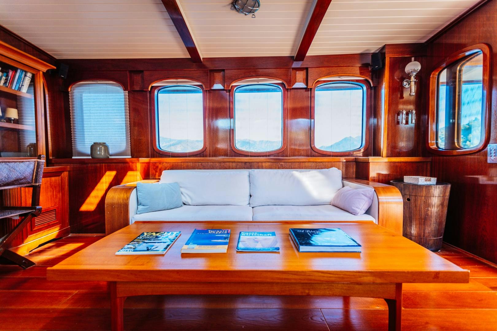 a living room with a couch and a table aboard LARIMAR Yacht for Sale