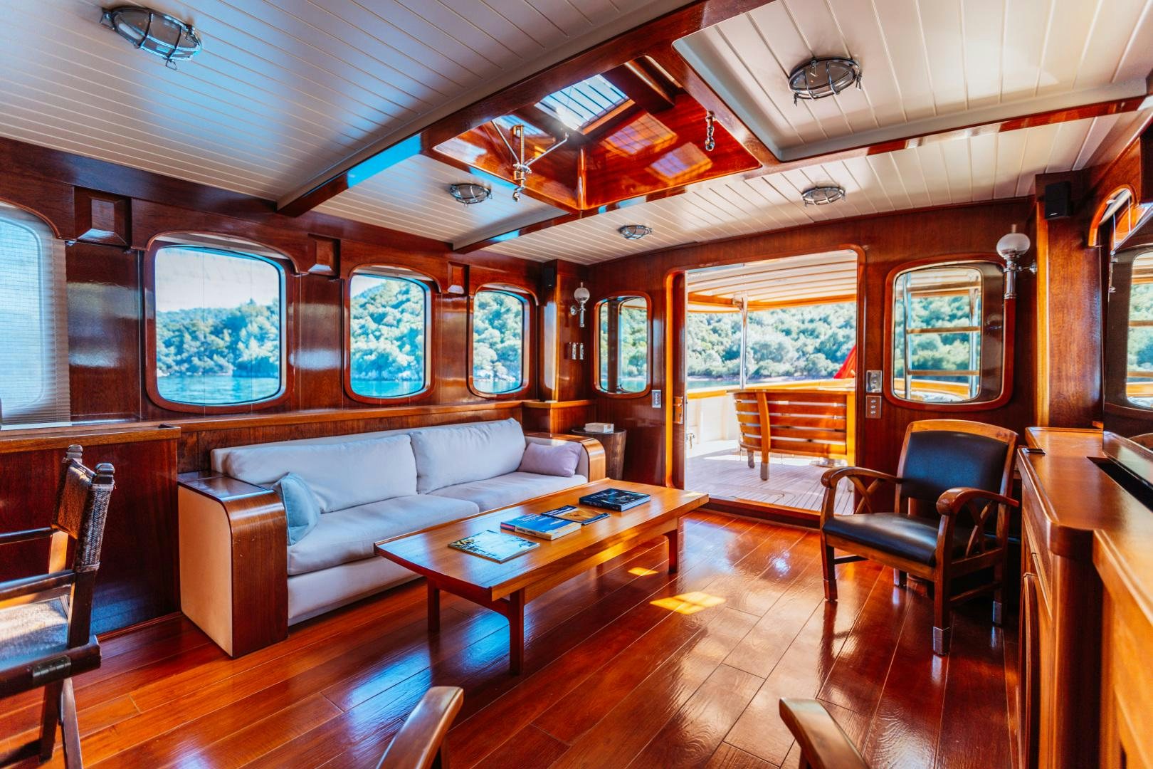 a living room with a couch and a table aboard LARIMAR Yacht for Sale