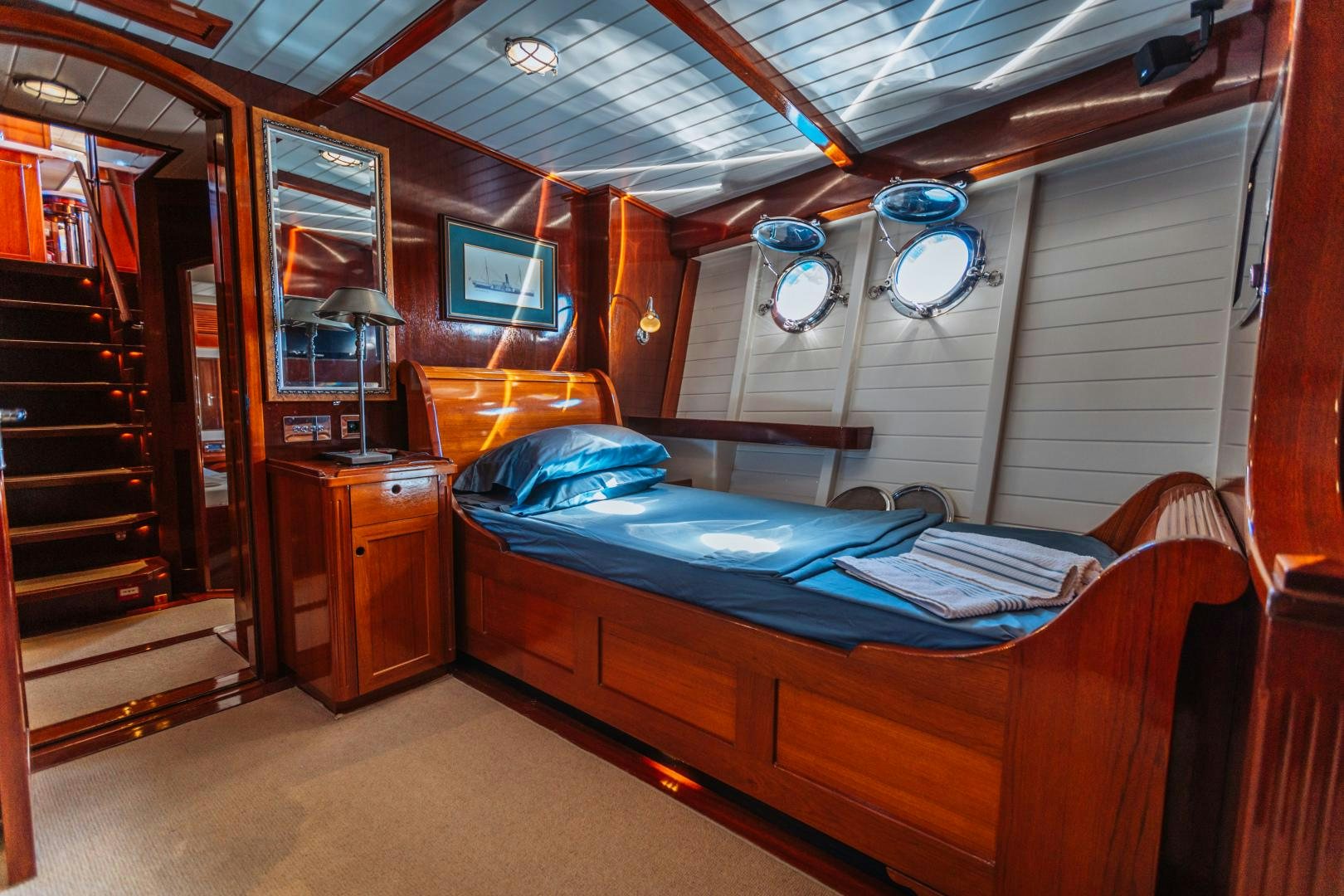 a cabin with a bed and a desk aboard LARIMAR Yacht for Sale
