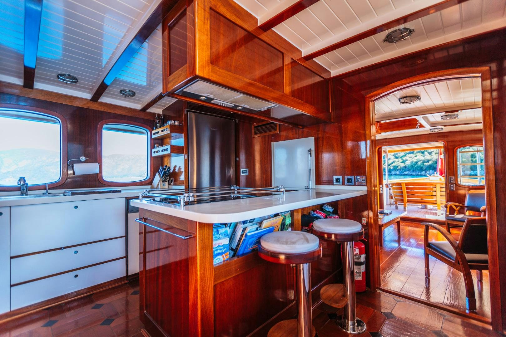 a kitchen with a bar and bar aboard LARIMAR Yacht for Sale