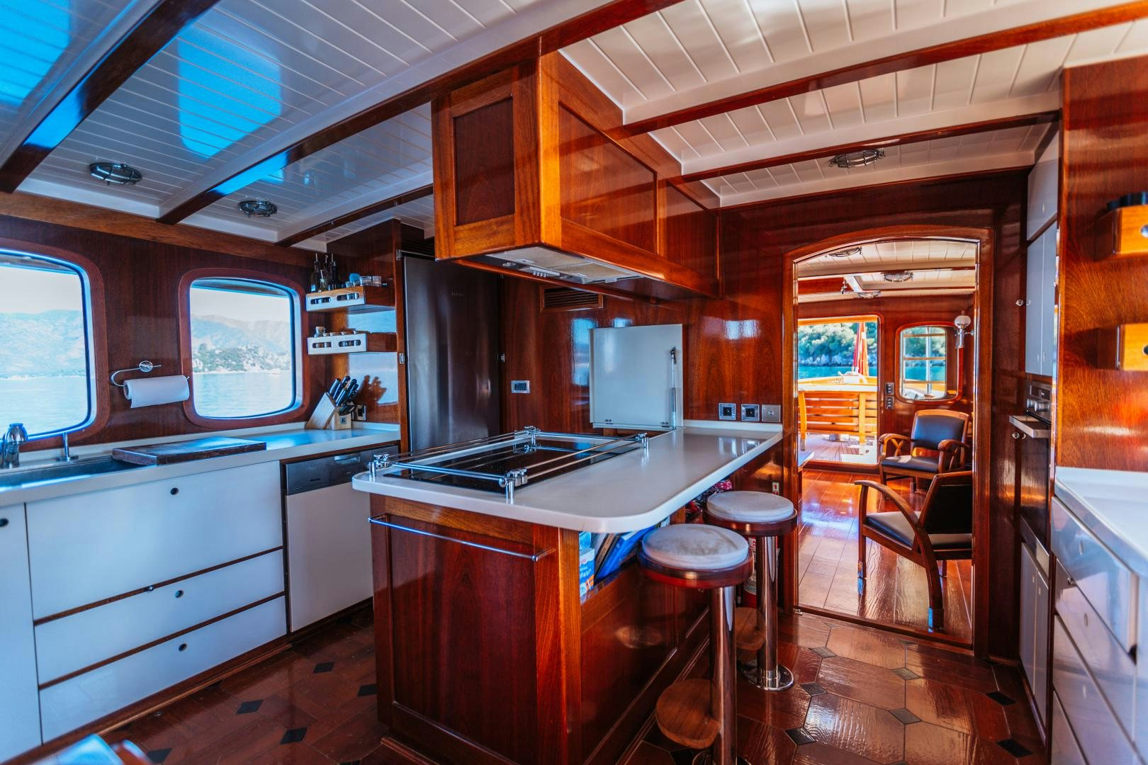 a kitchen with a bar and a bar aboard LARIMAR Yacht for Sale
