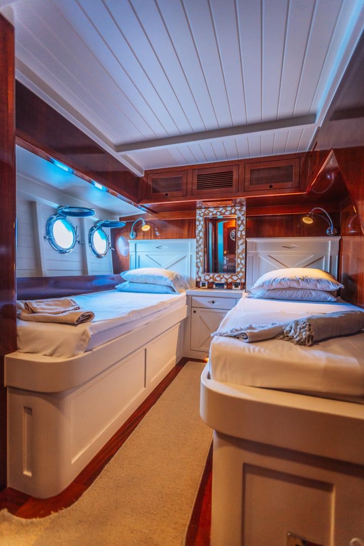 a room with two beds aboard LARIMAR Yacht for Sale