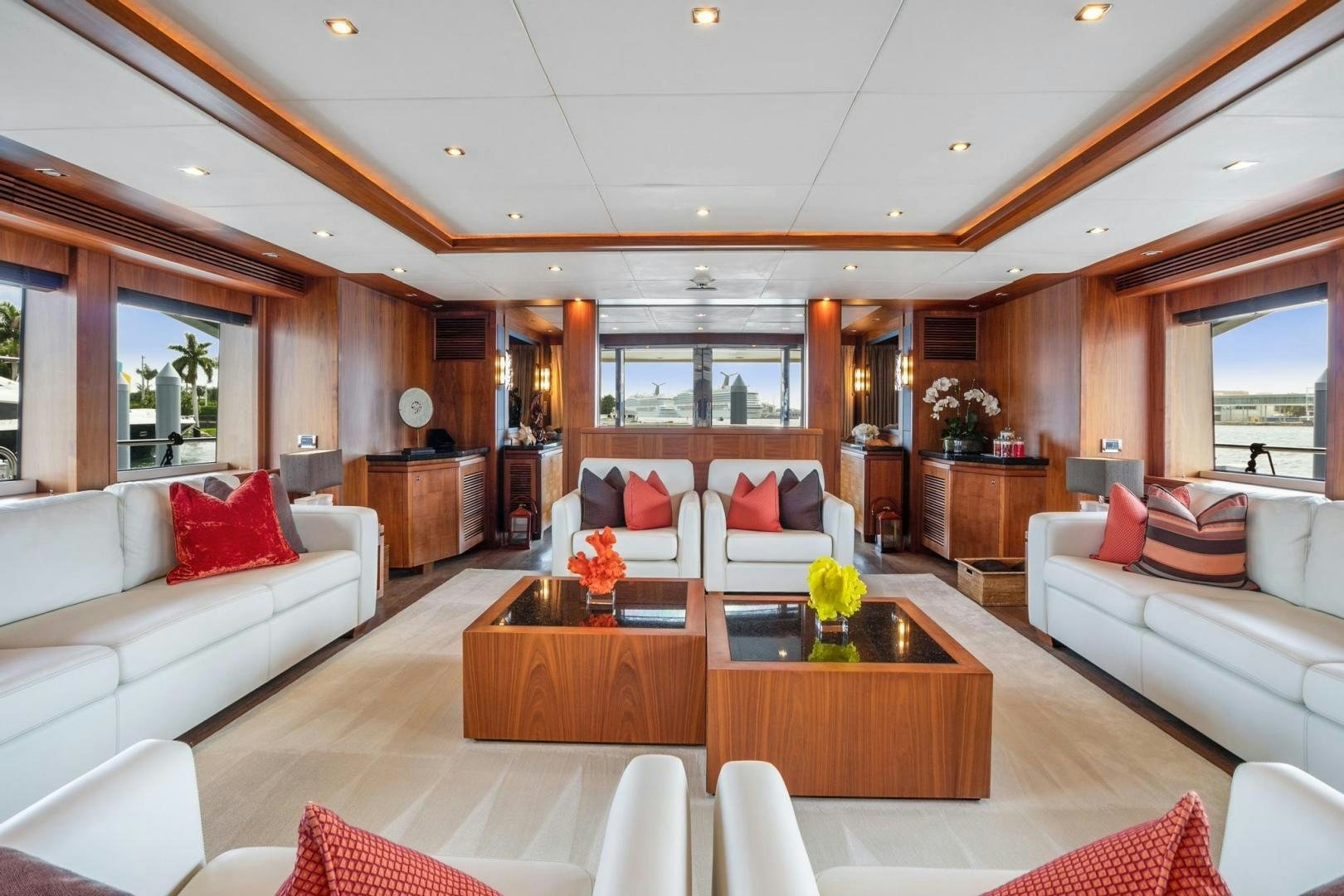 a living room with a white couch and a coffee table aboard ACACIA Yacht for Sale