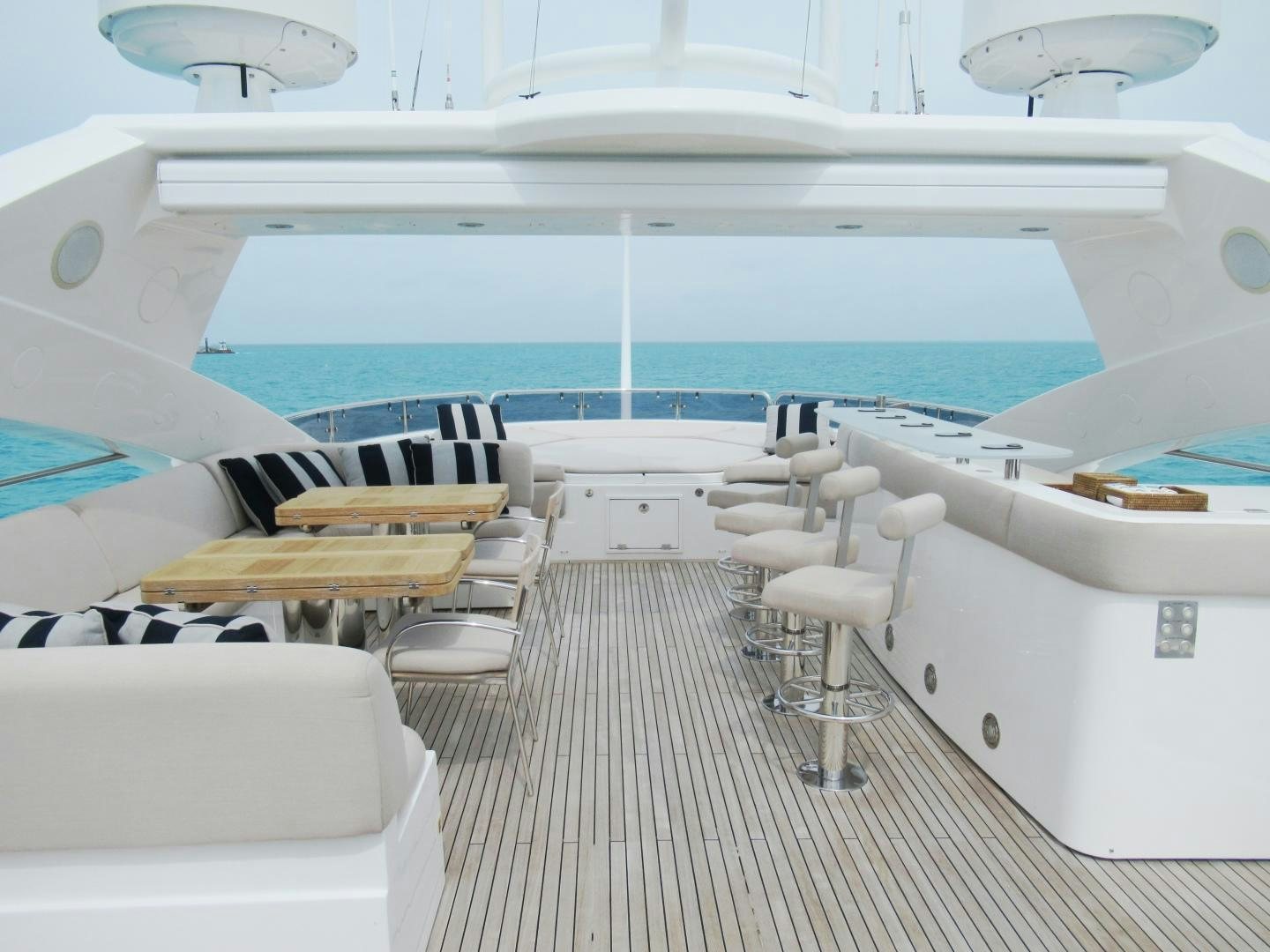 a boat with a deck and chairs aboard ACACIA Yacht for Sale
