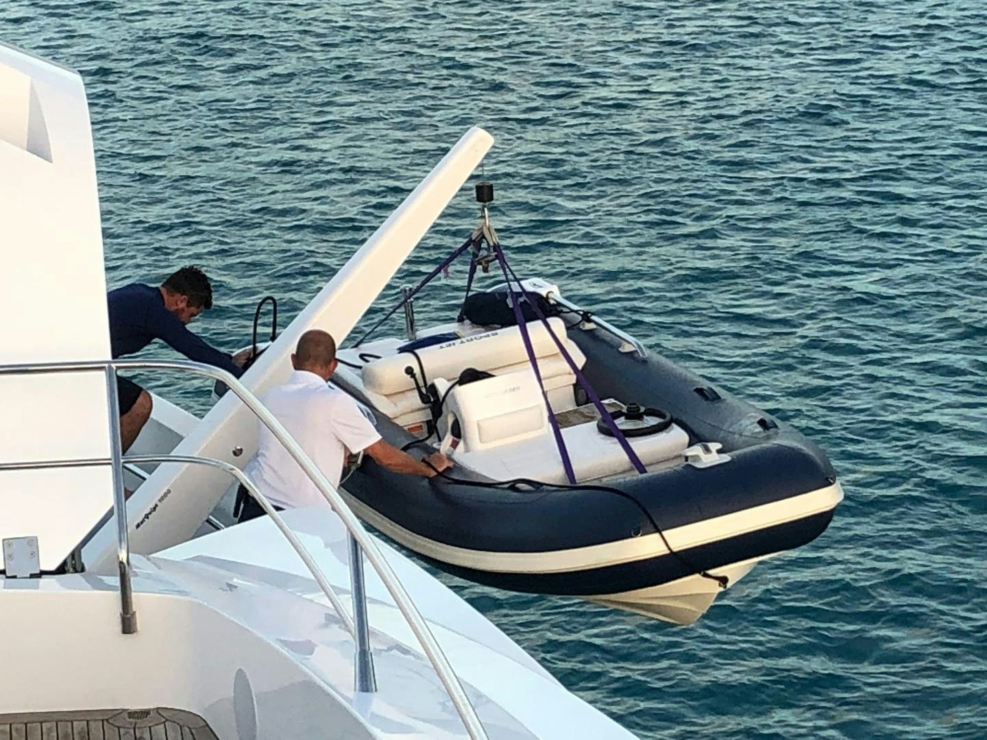 a couple of men on a boat aboard ACACIA Yacht for Sale