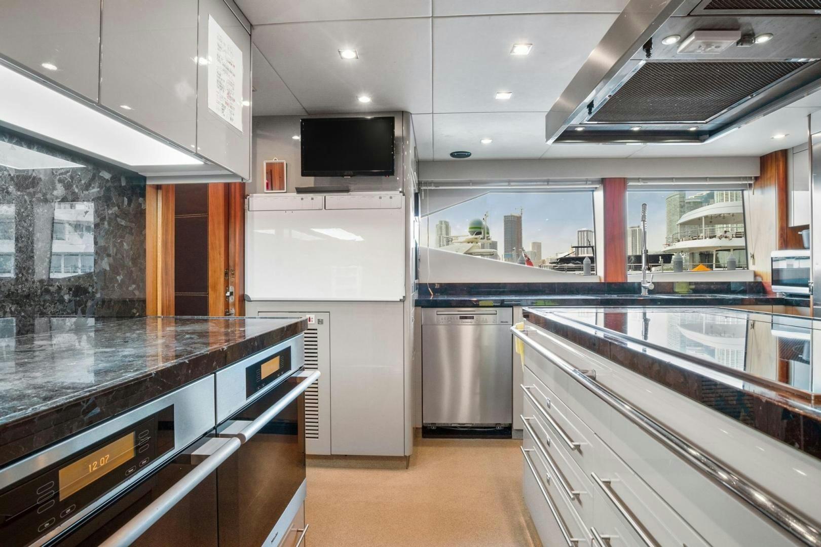 a kitchen with a large island aboard ACACIA Yacht for Sale