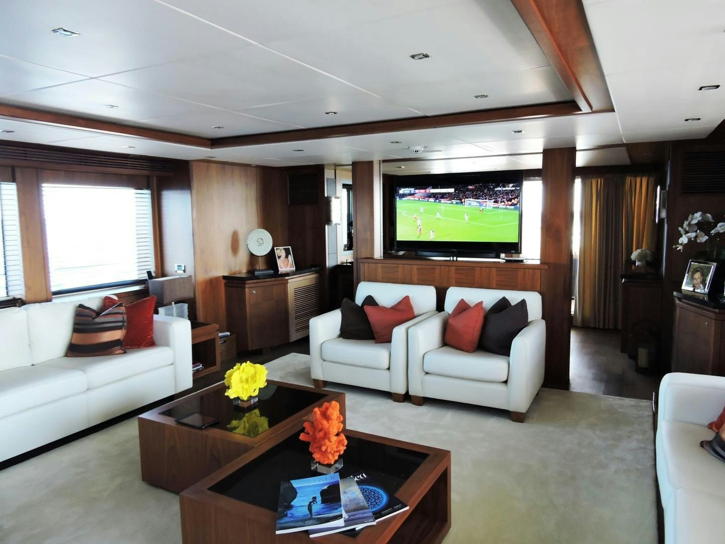a living room with a couch and a tv aboard ACACIA Yacht for Sale