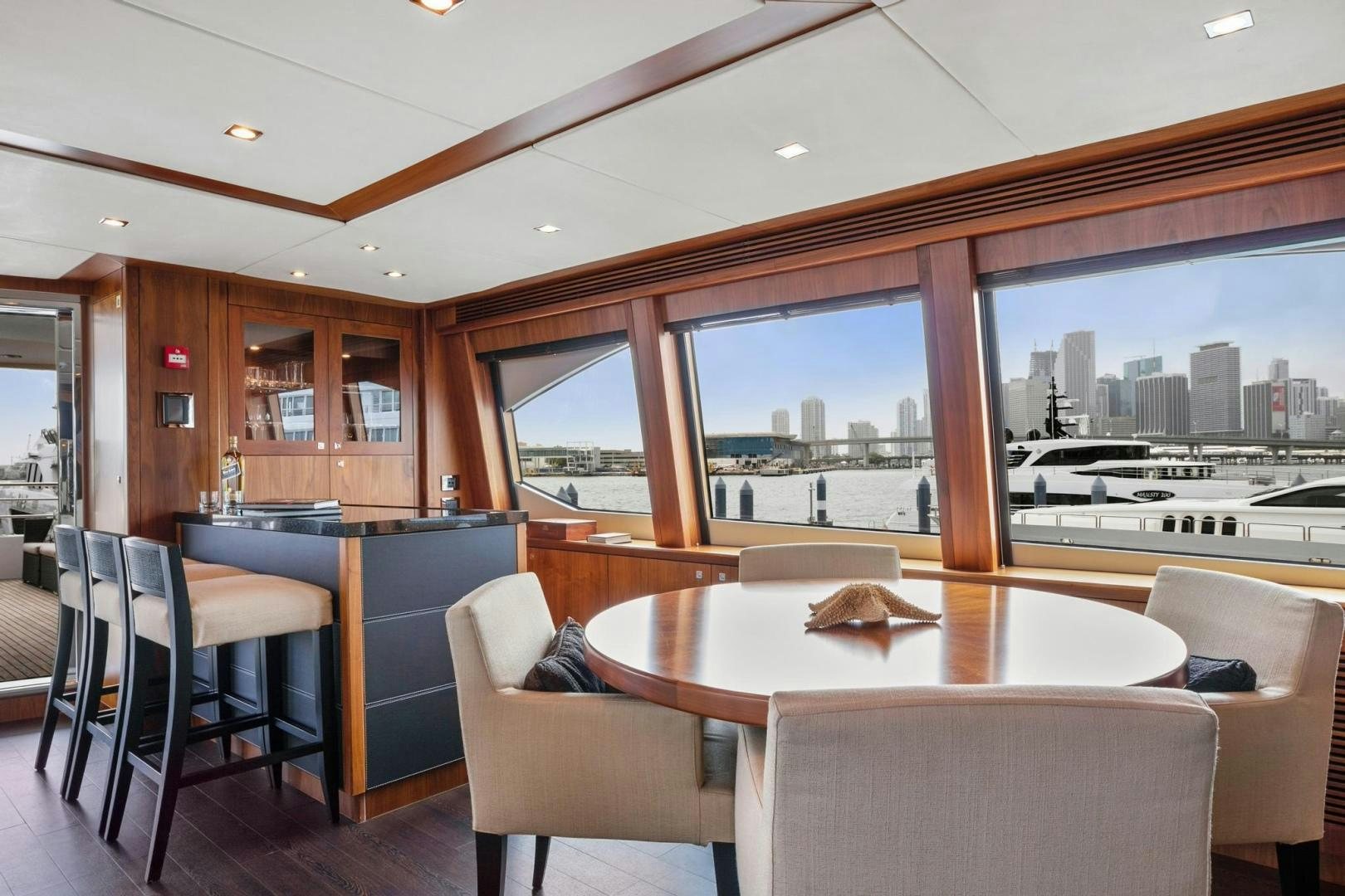 a room with a table and chairs aboard ACACIA Yacht for Sale