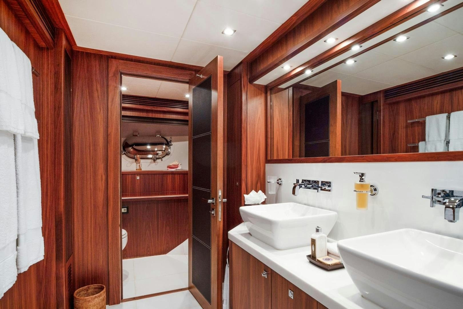 a bathroom with a sink and a mirror aboard ACACIA Yacht for Sale