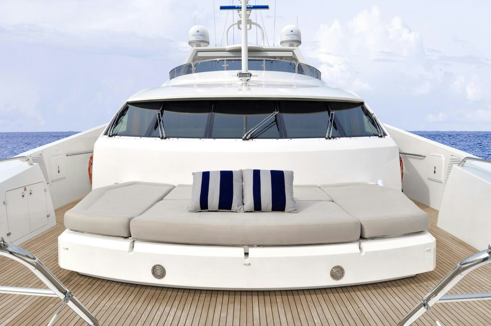a white yacht on a deck aboard ACACIA Yacht for Sale