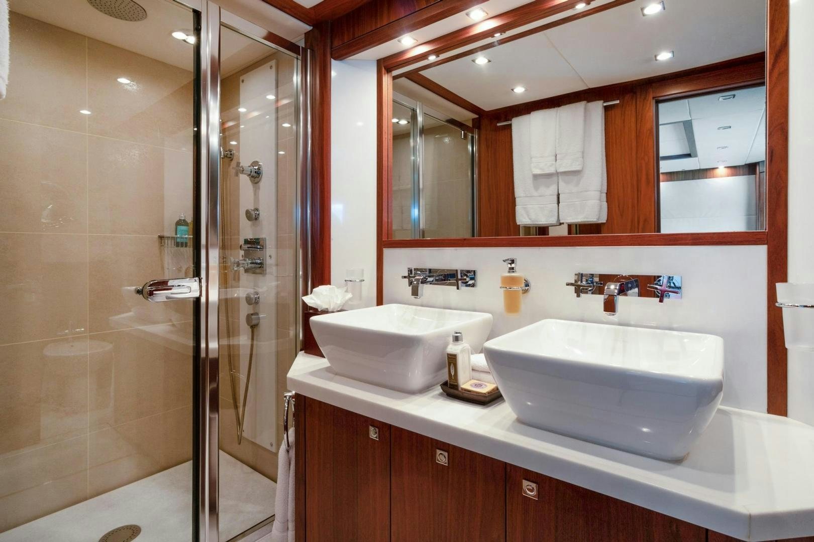 a bathroom with a sink and a shower aboard ACACIA Yacht for Sale