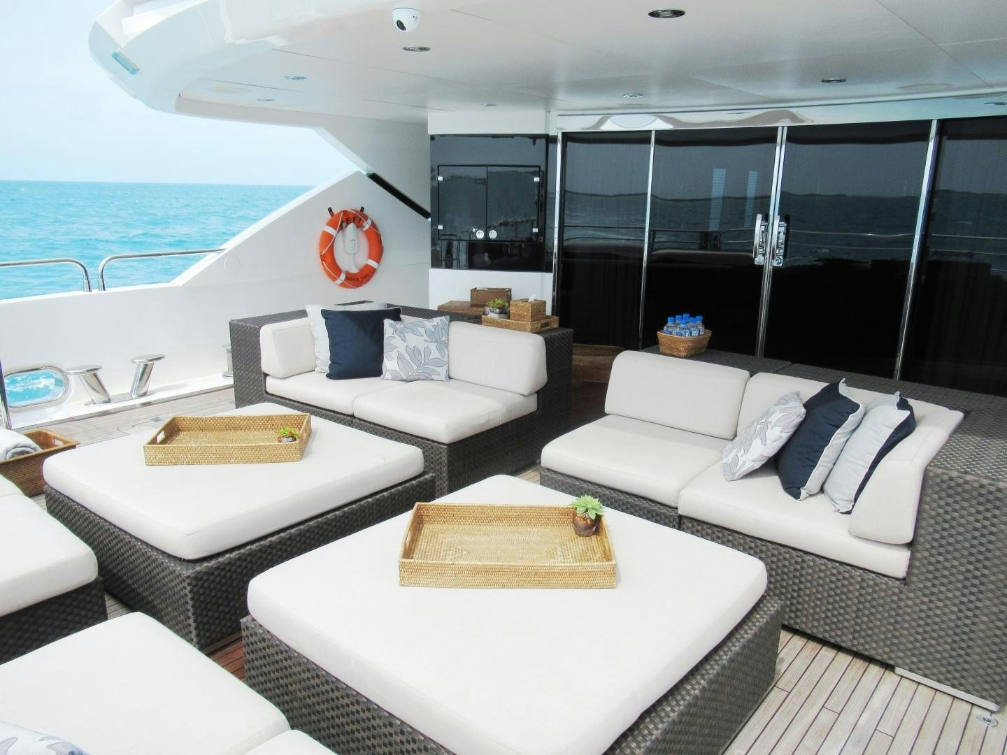 a living room with a large balcony aboard ACACIA Yacht for Sale