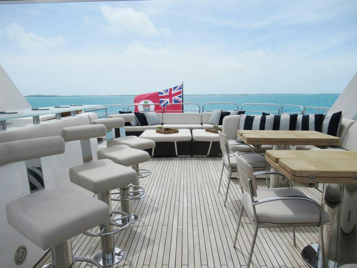 a room with tables and chairs aboard ACACIA Yacht for Sale