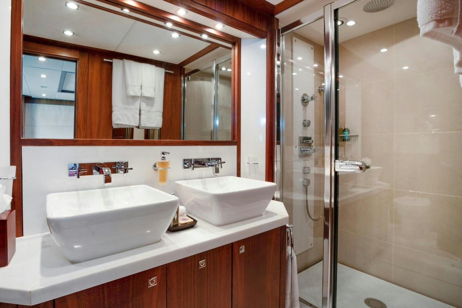 a bathroom with a sink and a shower aboard ACACIA Yacht for Sale