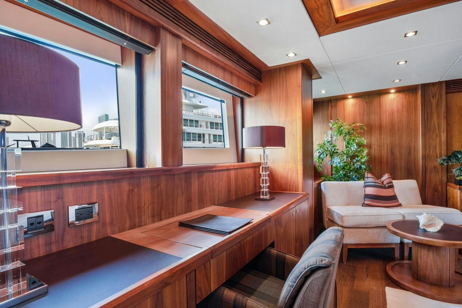 a room with a couch and a table aboard ACACIA Yacht for Sale