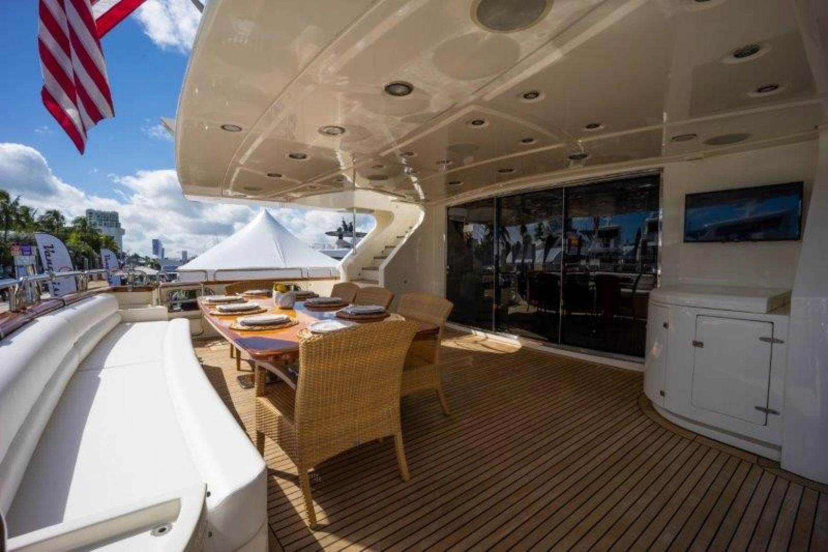 a room with tables and chairs aboard NYHAVEN Yacht for Sale