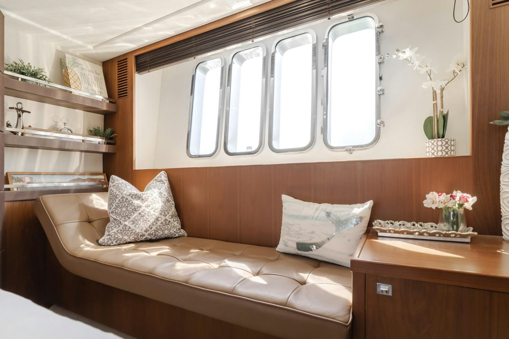 a bed with a white pillow aboard KOINONIA Yacht for Sale