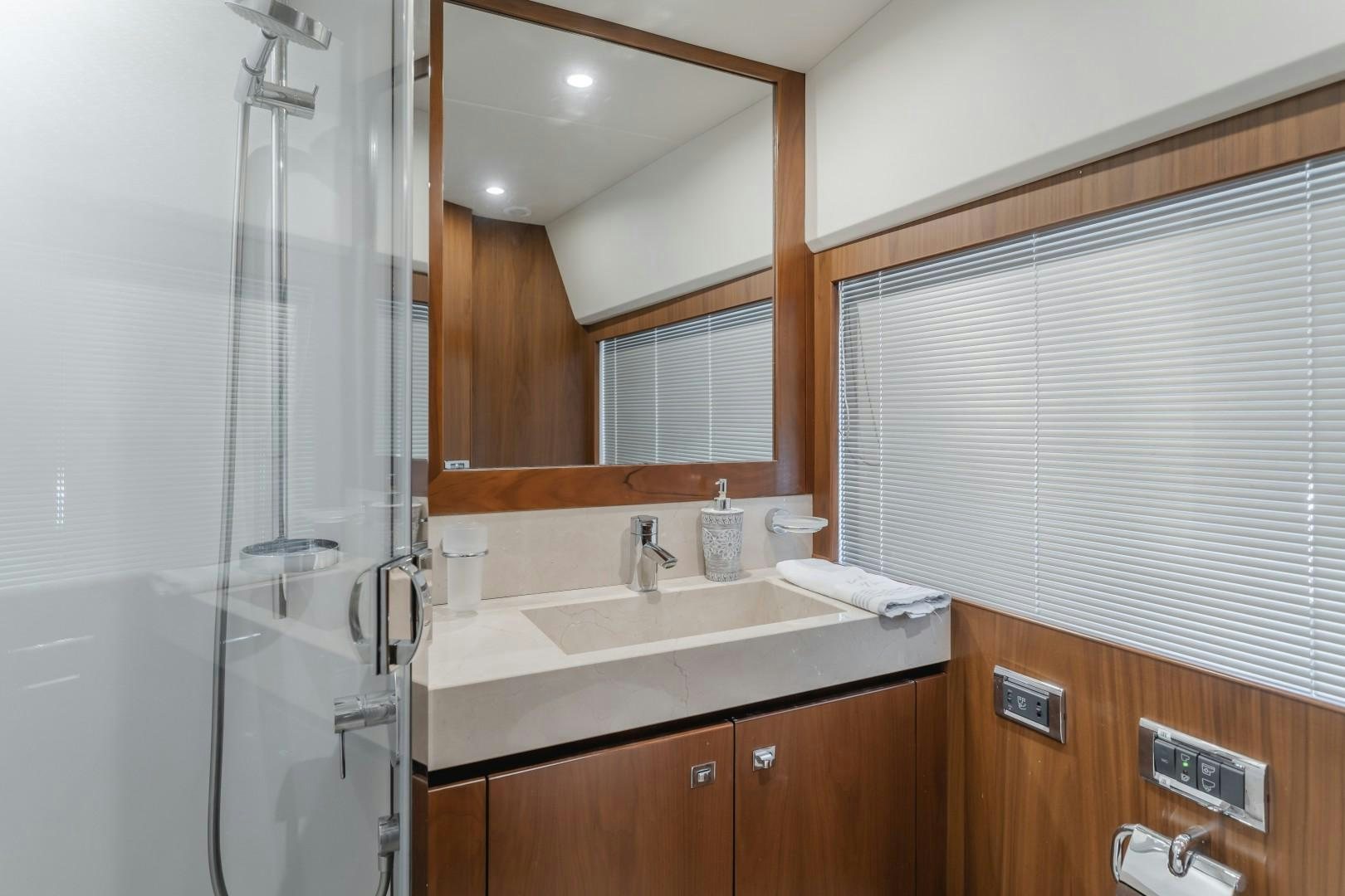 a bathroom with a sink and a shower aboard KOINONIA Yacht for Sale
