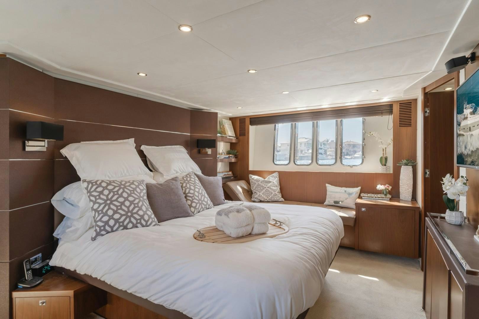 a bedroom with a bed and a mirror aboard KOINONIA Yacht for Sale