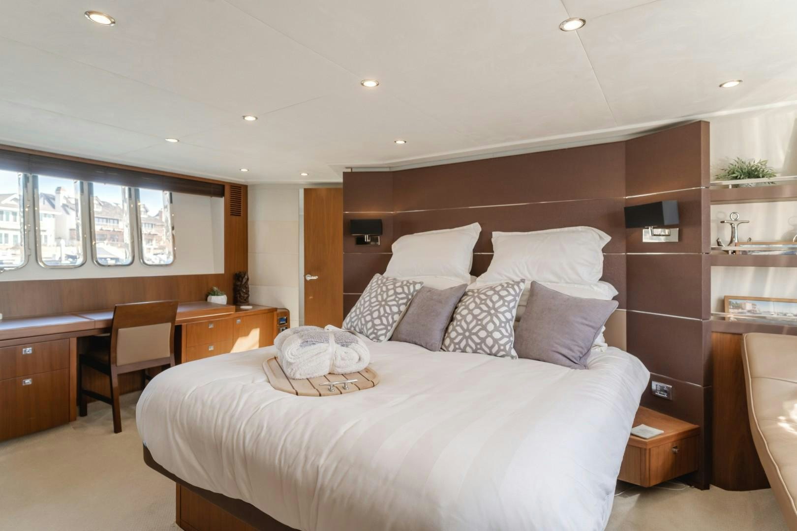 a bedroom with a large bed aboard KOINONIA Yacht for Sale