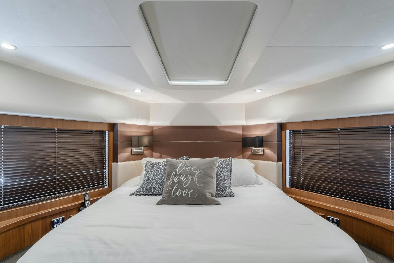 a bed with pillows aboard KOINONIA Yacht for Sale