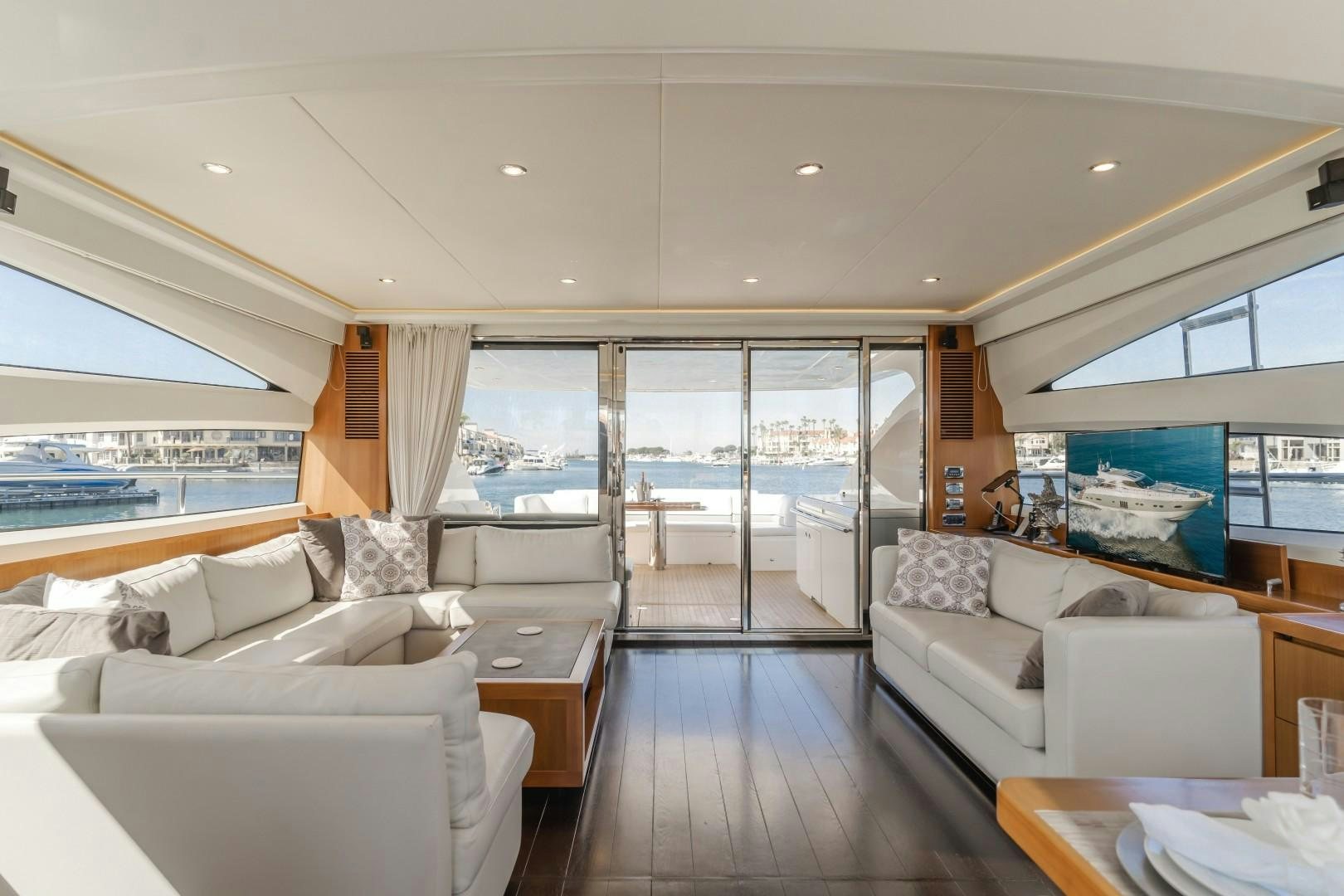a living room with a large window aboard KOINONIA Yacht for Sale