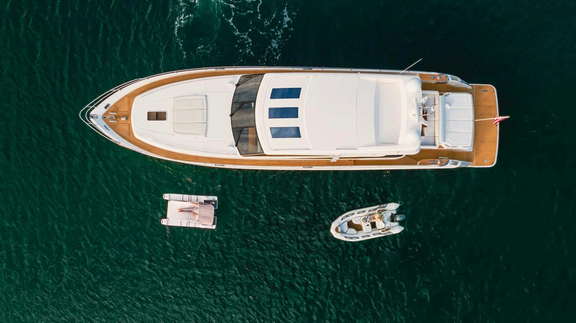 a small toy boat on a green surface aboard KOINONIA Yacht for Sale
