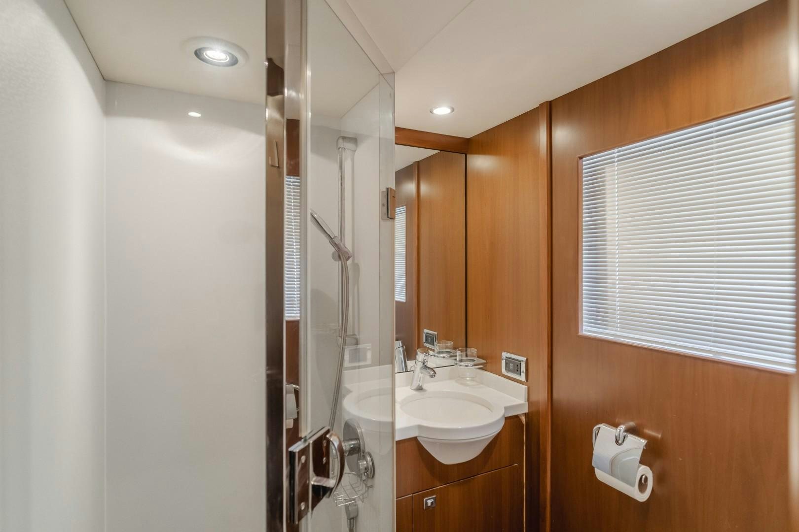 a bathroom with a sink and a mirror aboard KOINONIA Yacht for Sale