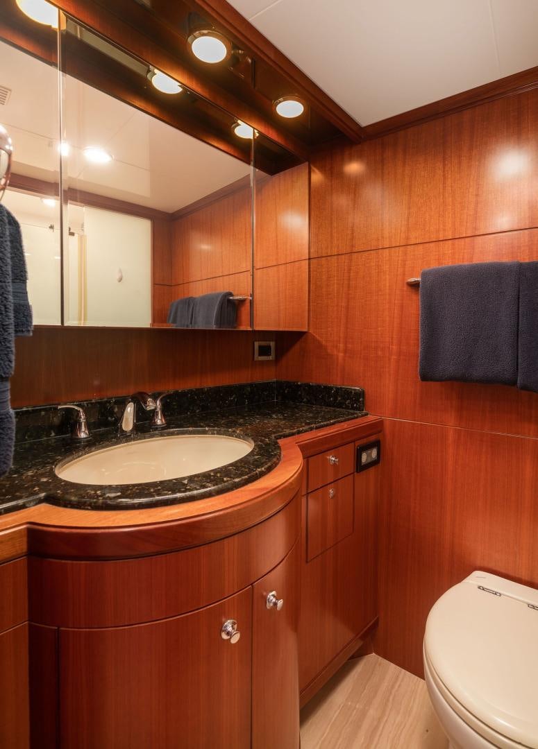 a bathroom with a sink and a mirror aboard LADY GIGI Yacht for Sale