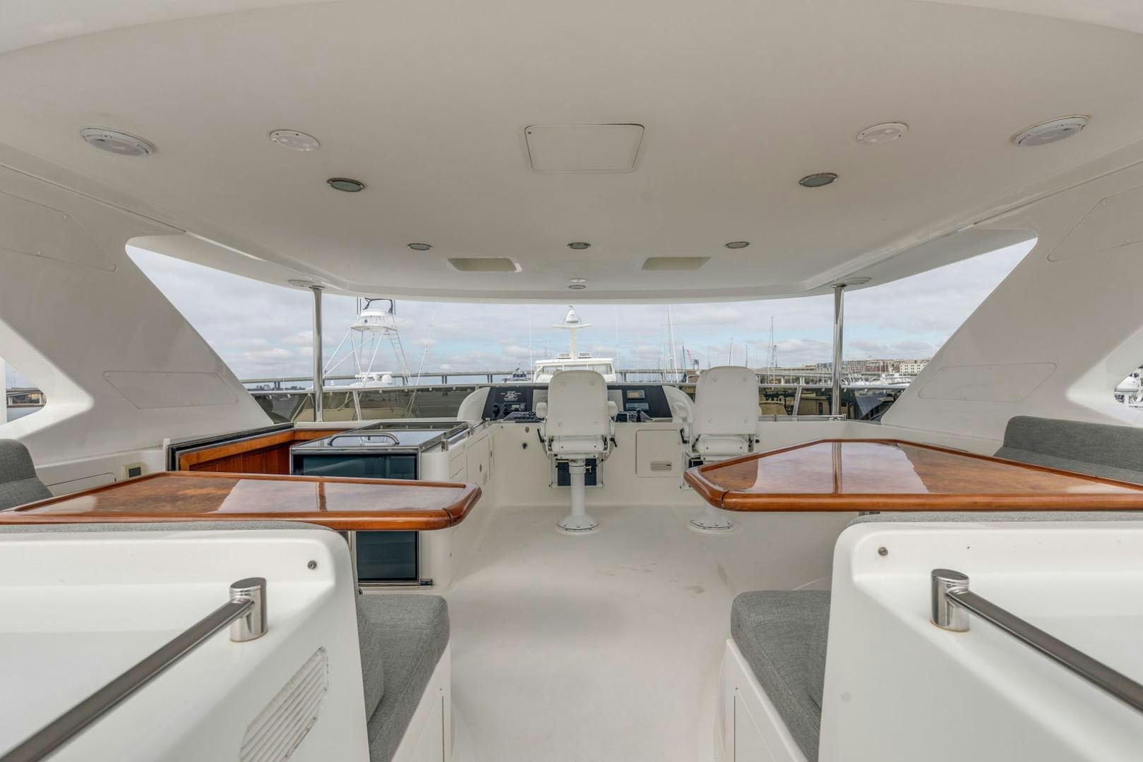 a room with a table and chairs aboard LADY GIGI Yacht for Sale