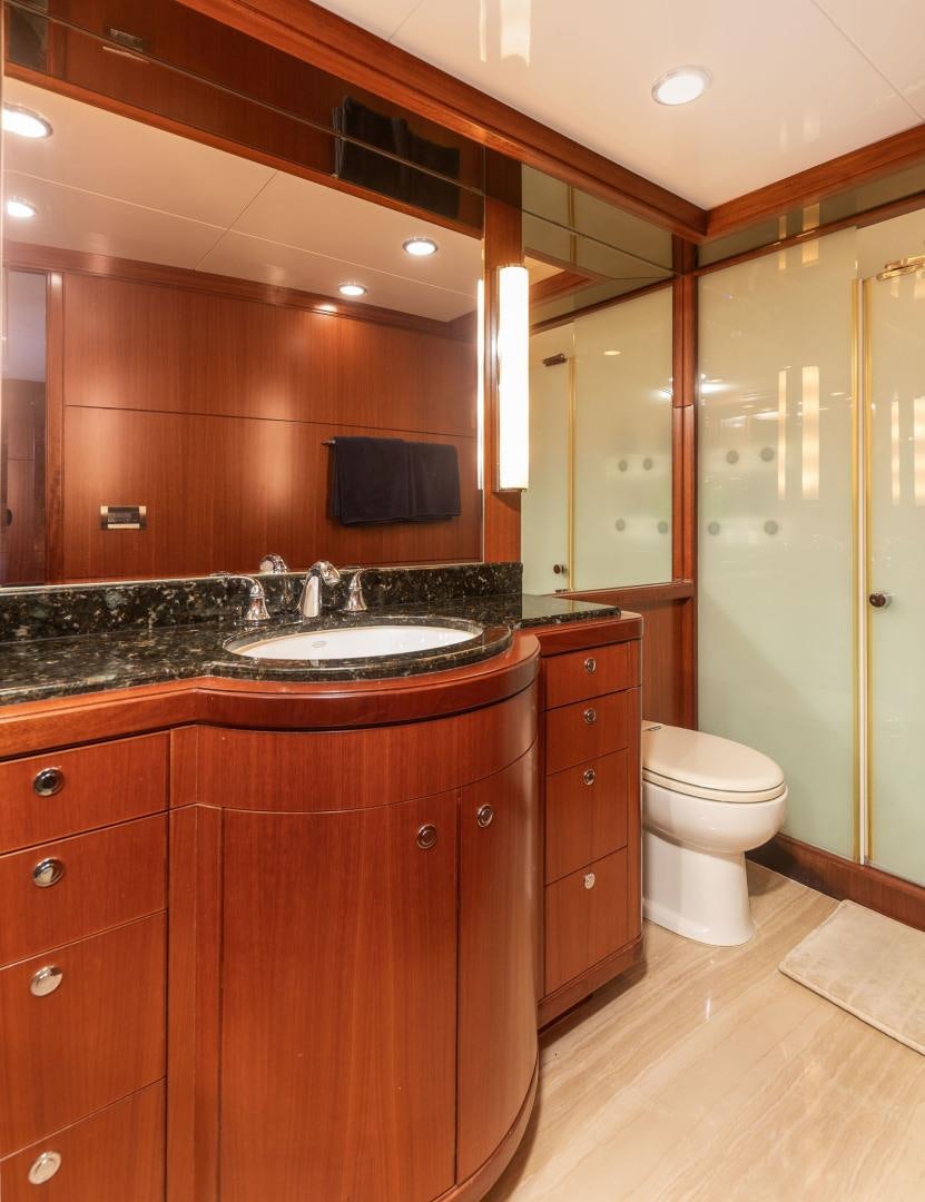 a bathroom with a sink and a toilet aboard LADY GIGI Yacht for Sale