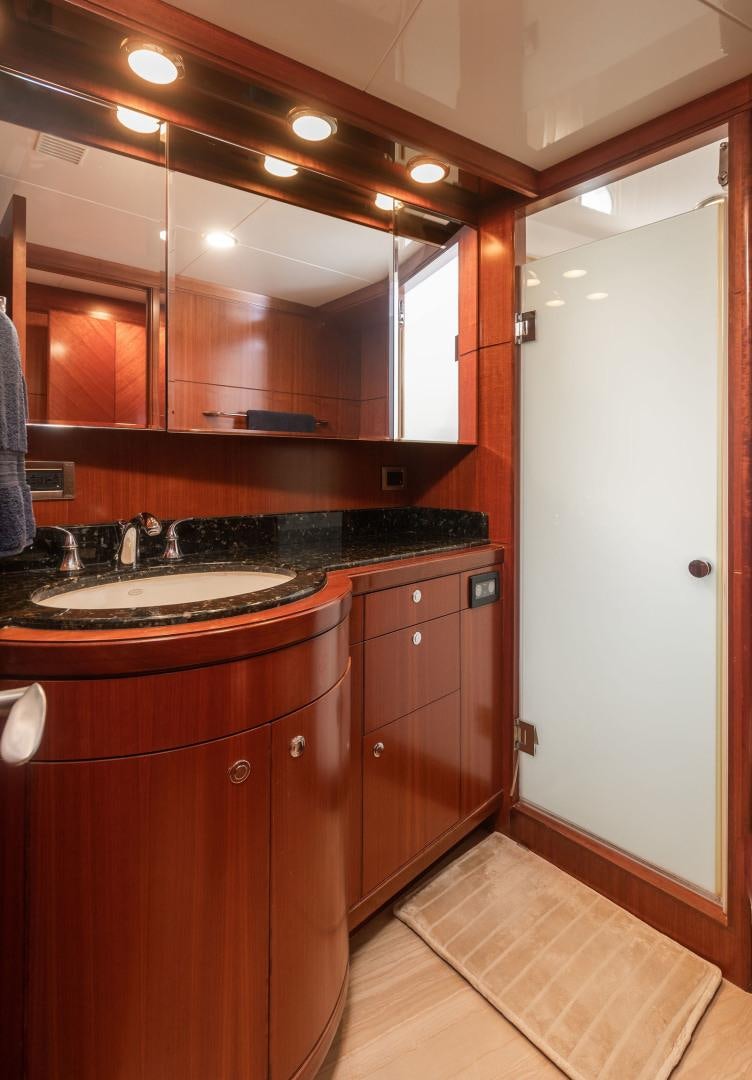 a bathroom with a sink and a mirror aboard LADY GIGI Yacht for Sale