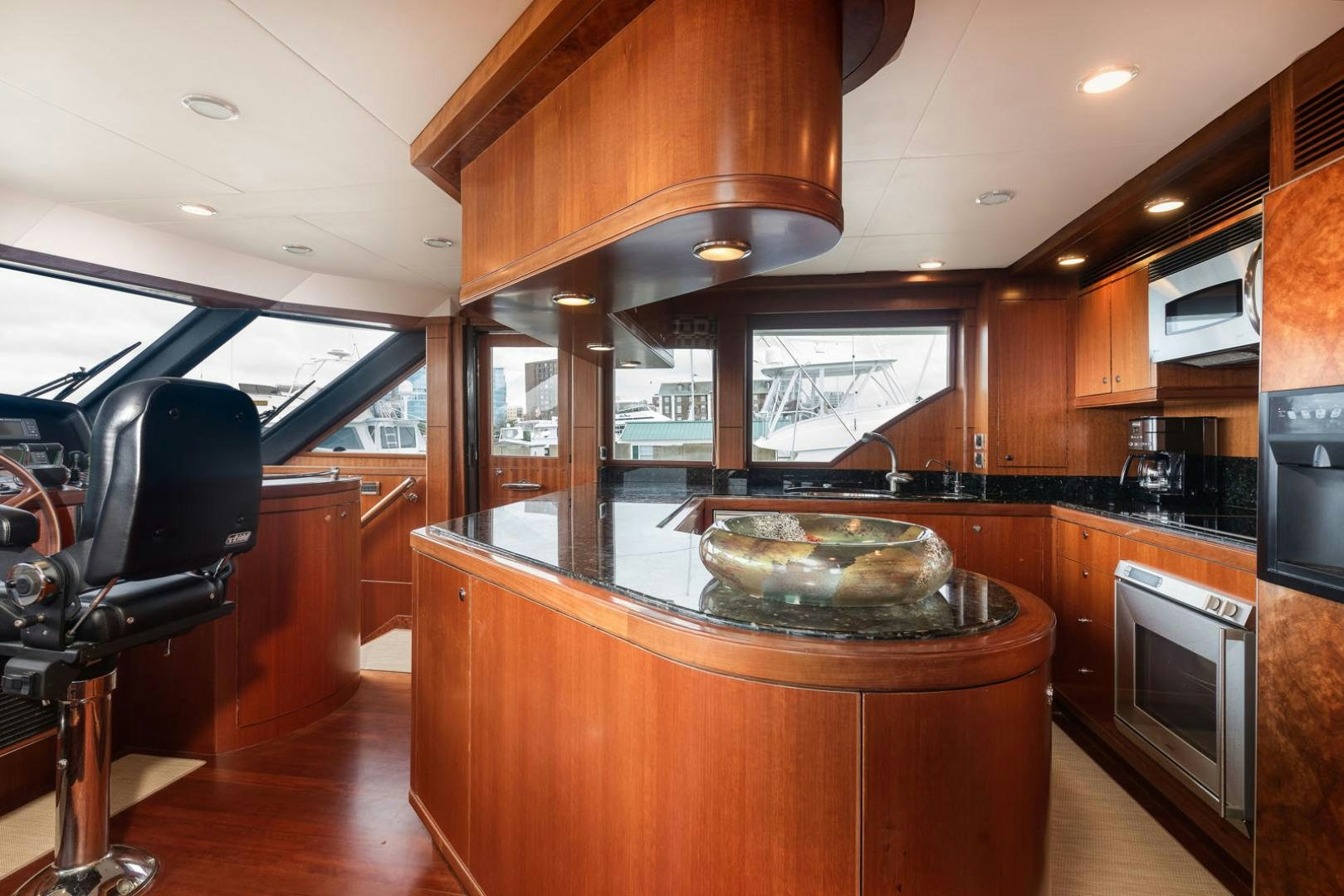 a kitchen with a large island aboard LADY GIGI Yacht for Sale