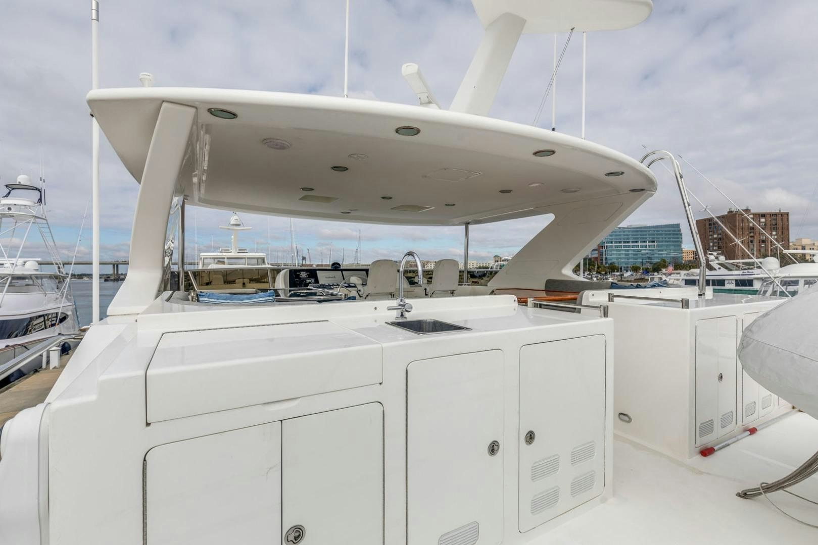 a large white boat with many white containers on it aboard LADY GIGI Yacht for Sale