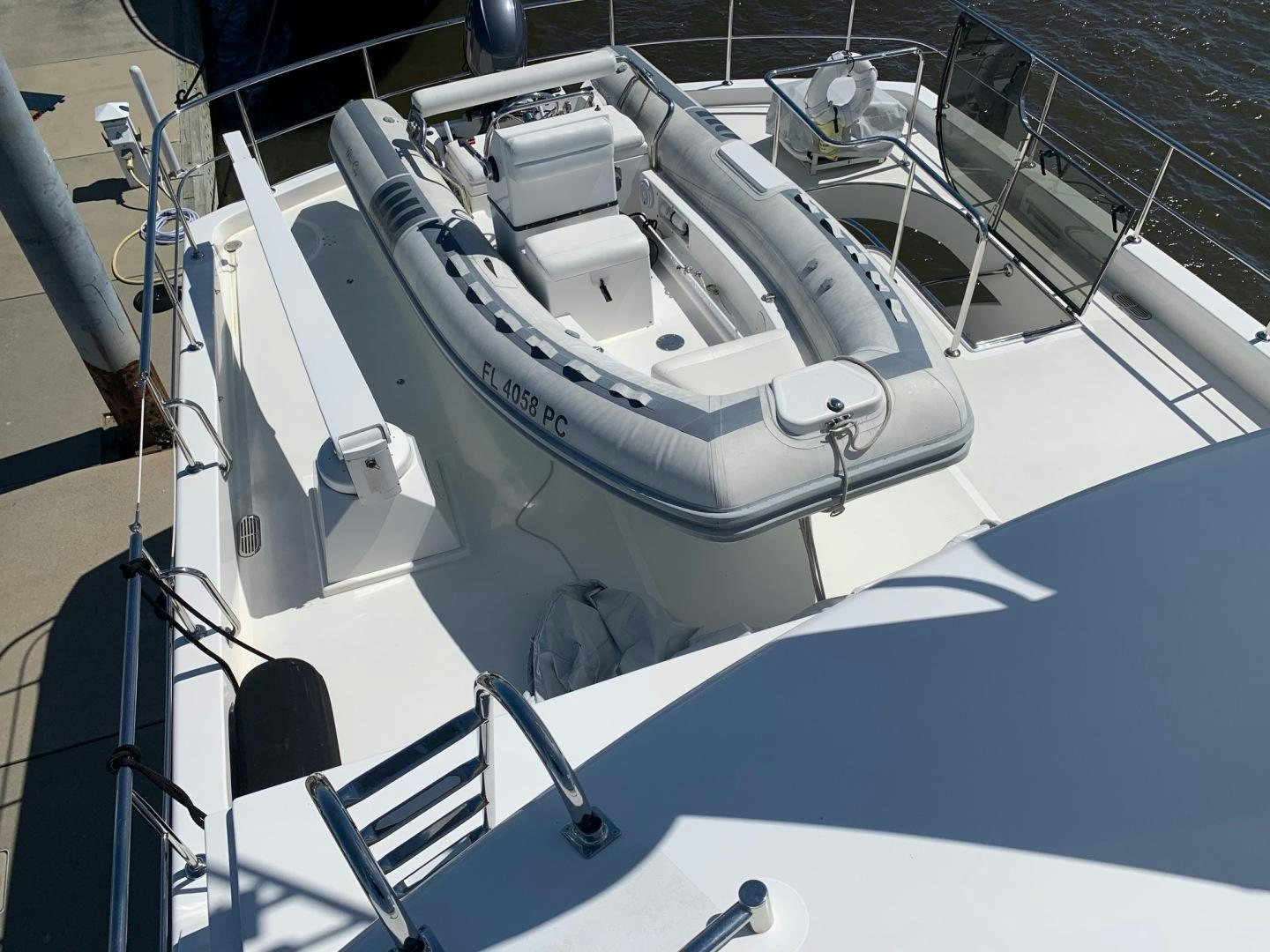 a white boat on a white boat aboard LADY GIGI Yacht for Sale