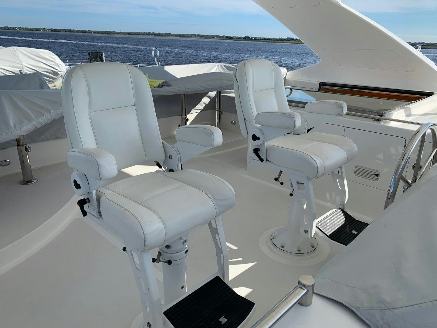 a group of chairs on a plane aboard LADY GIGI Yacht for Sale