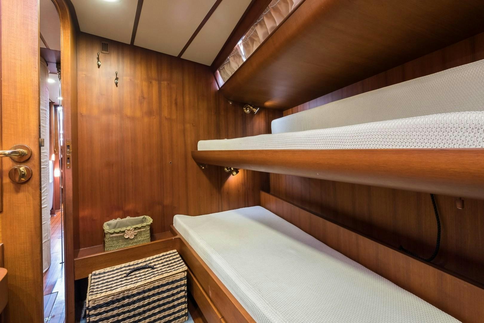 a room with a bed and a closet aboard ARQUIMEDES Yacht for Sale