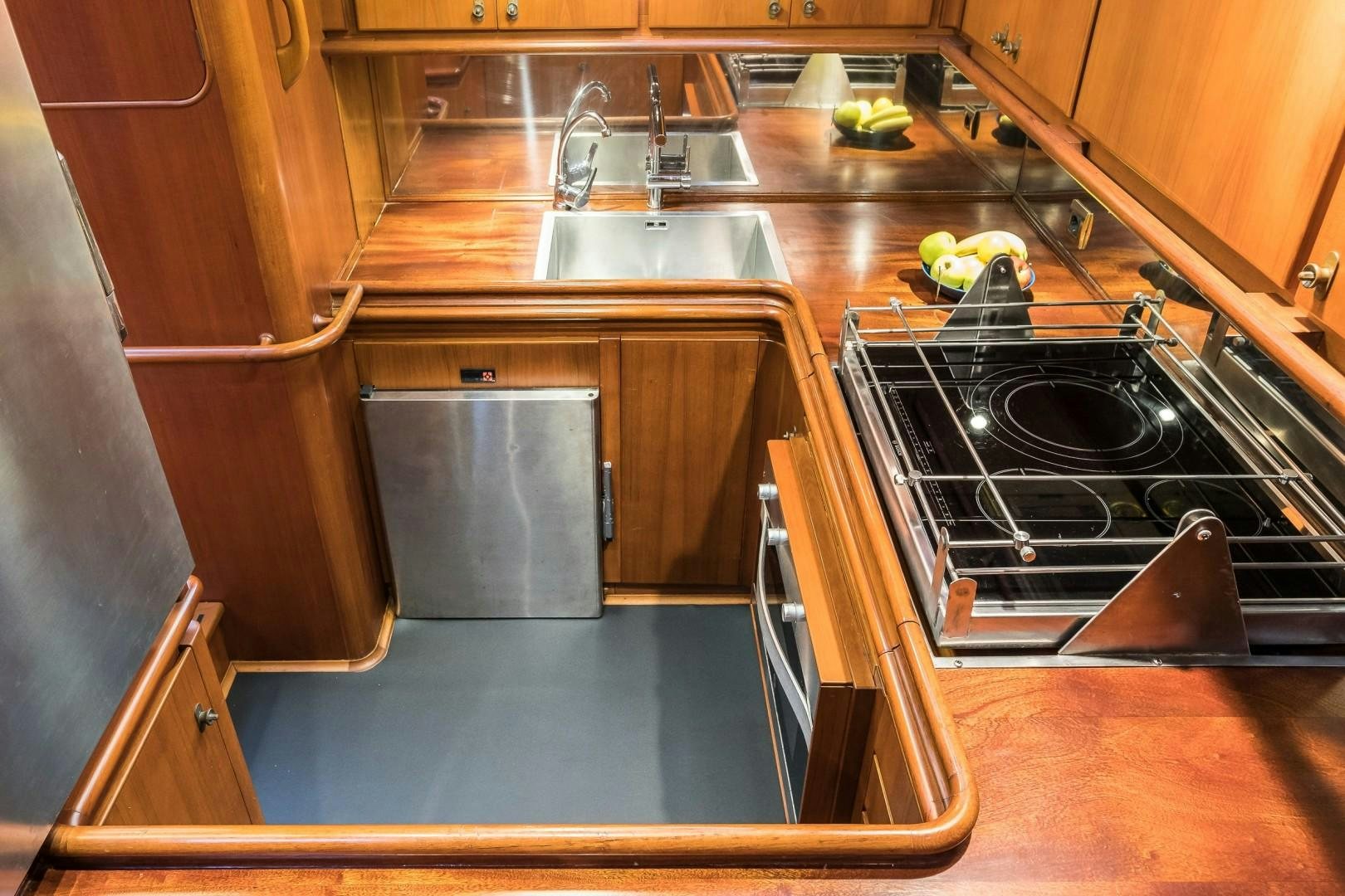 a kitchen with a stove and sink aboard ARQUIMEDES Yacht for Sale