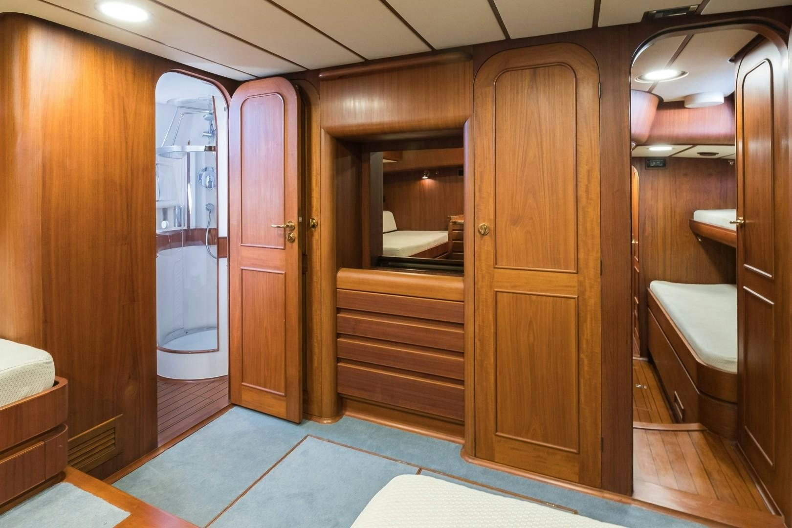 a bathroom with wooden doors aboard ARQUIMEDES Yacht for Sale