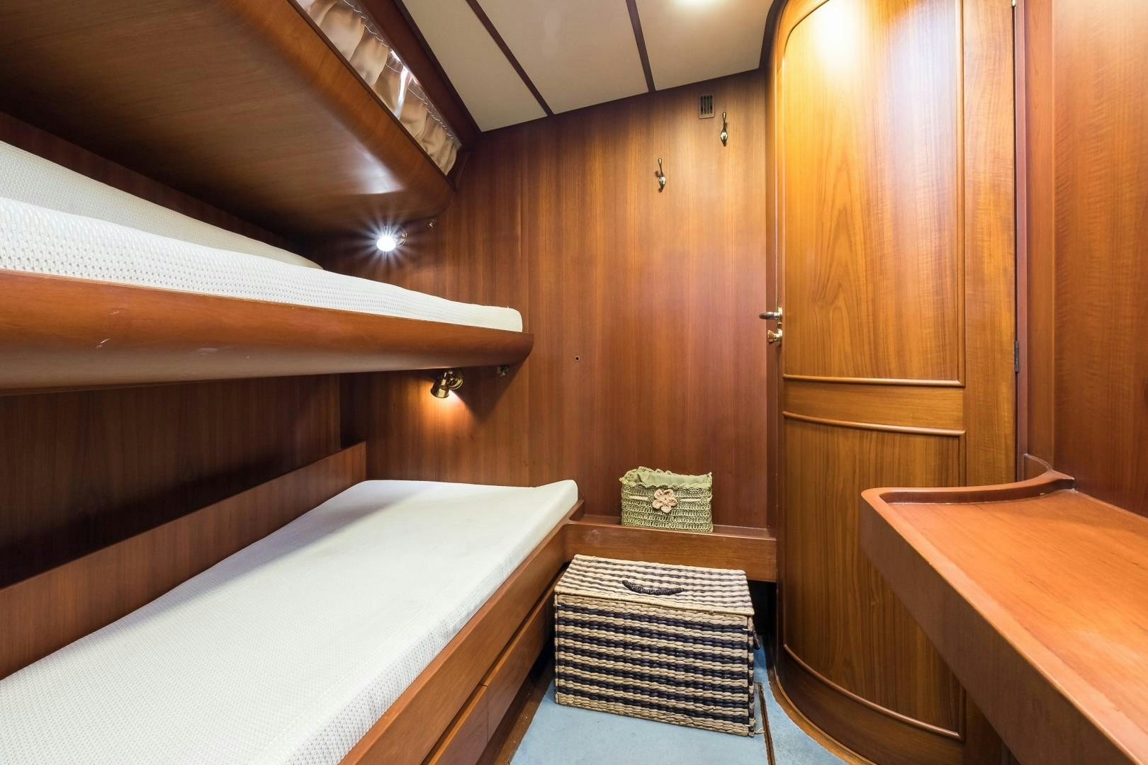 a room with a bed and a table aboard ARQUIMEDES Yacht for Sale