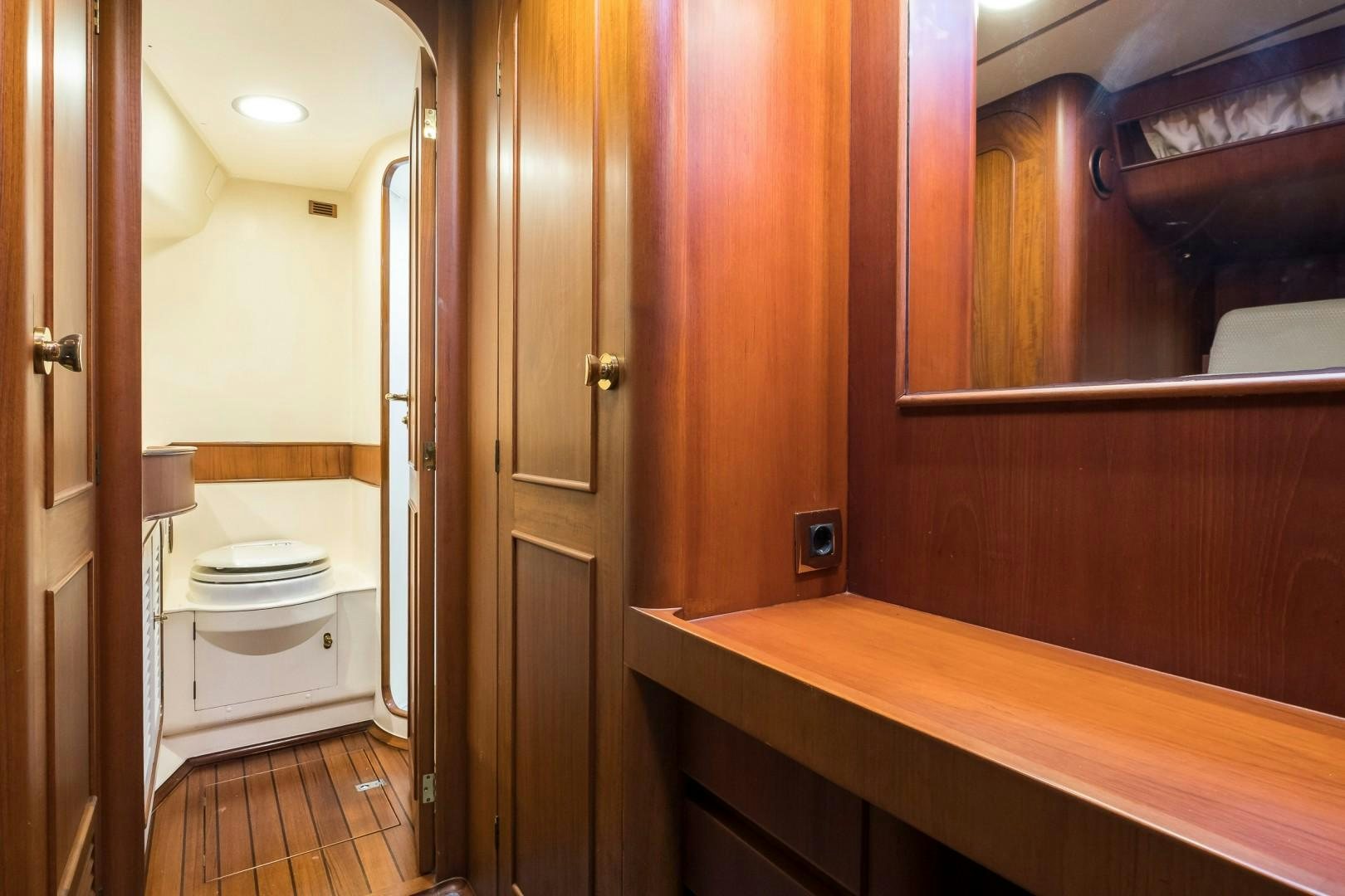 a bathroom with wooden cabinets aboard ARQUIMEDES Yacht for Sale