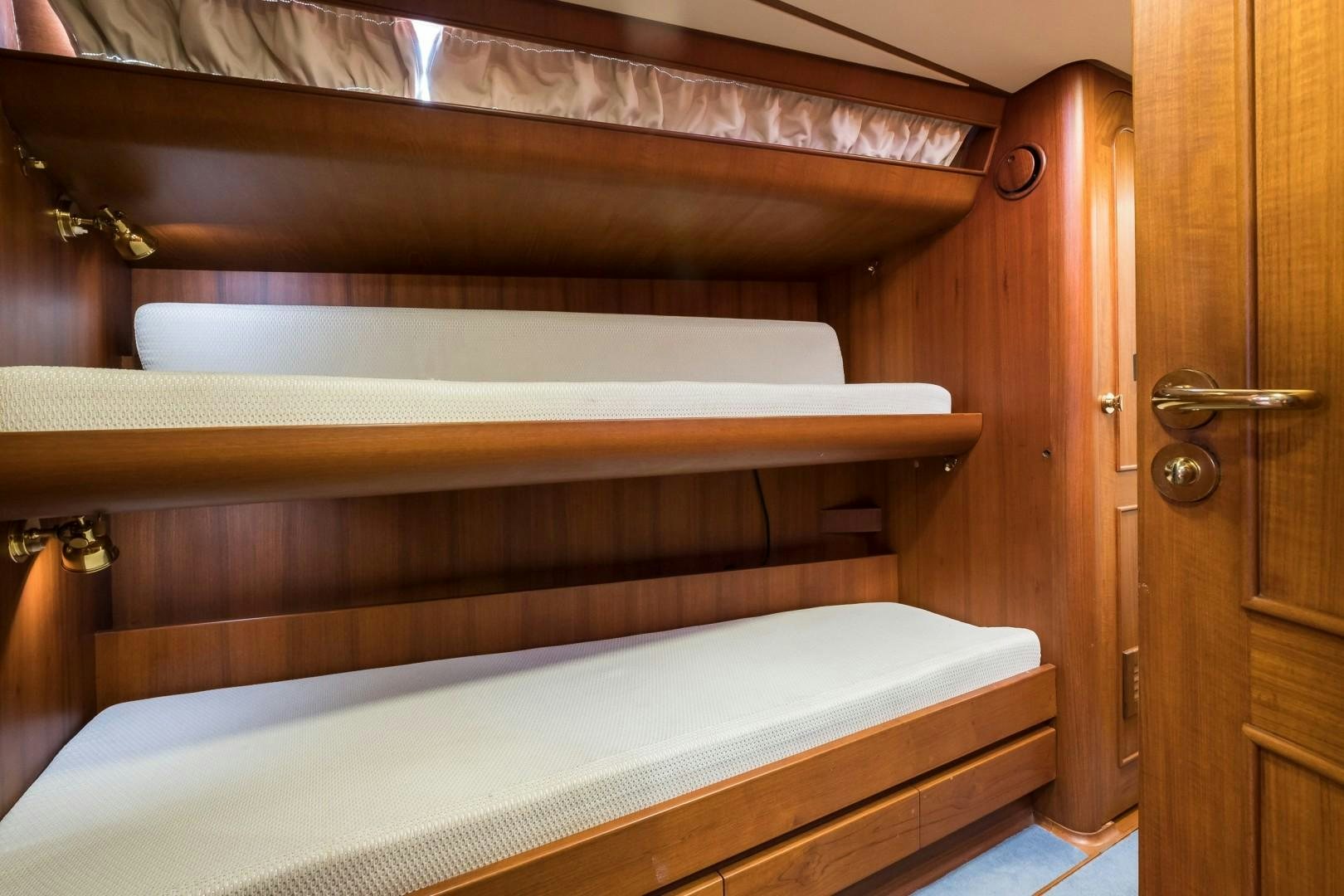 a bed with white sheets aboard ARQUIMEDES Yacht for Sale