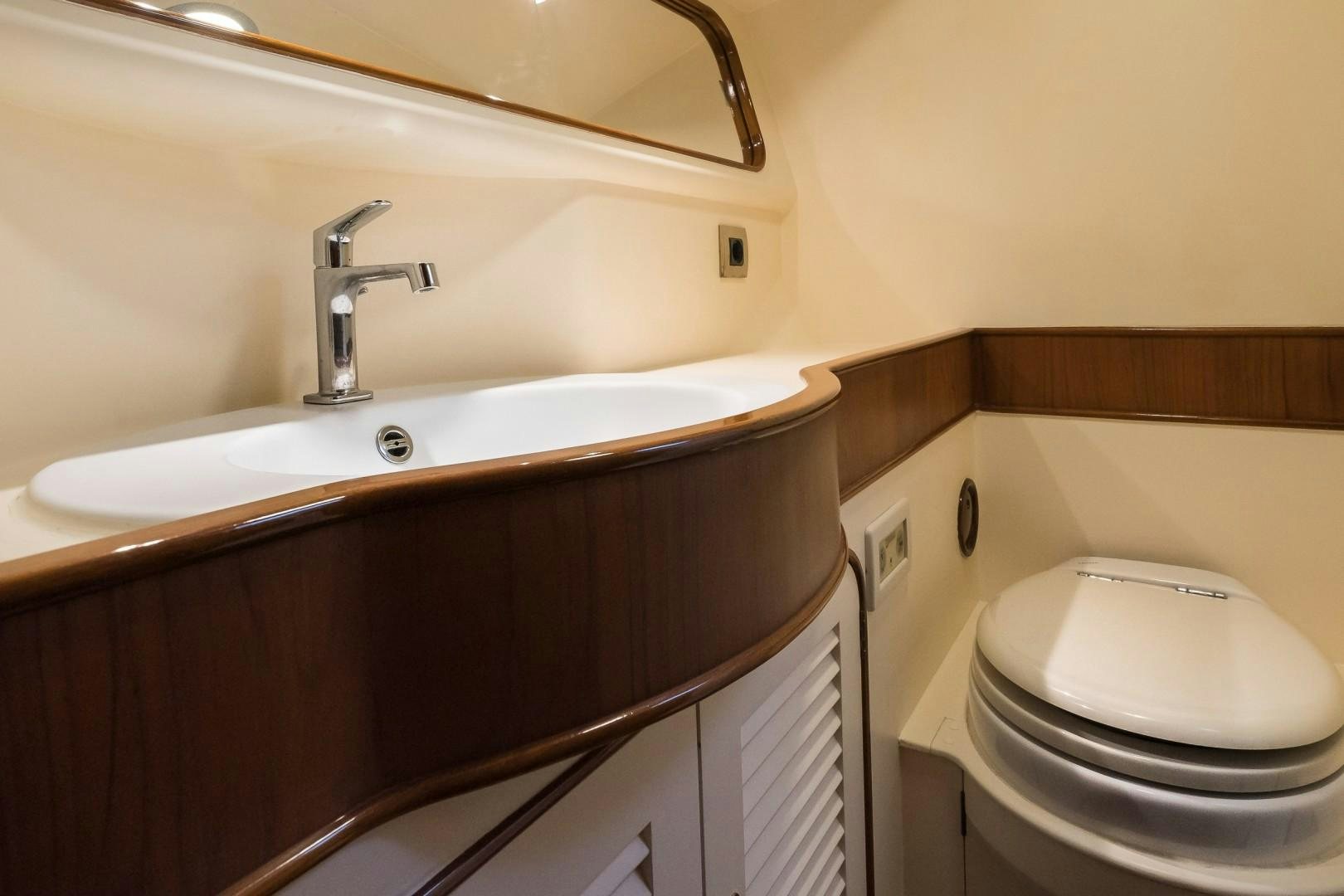 a bathroom with a toilet and sink aboard ARQUIMEDES Yacht for Sale