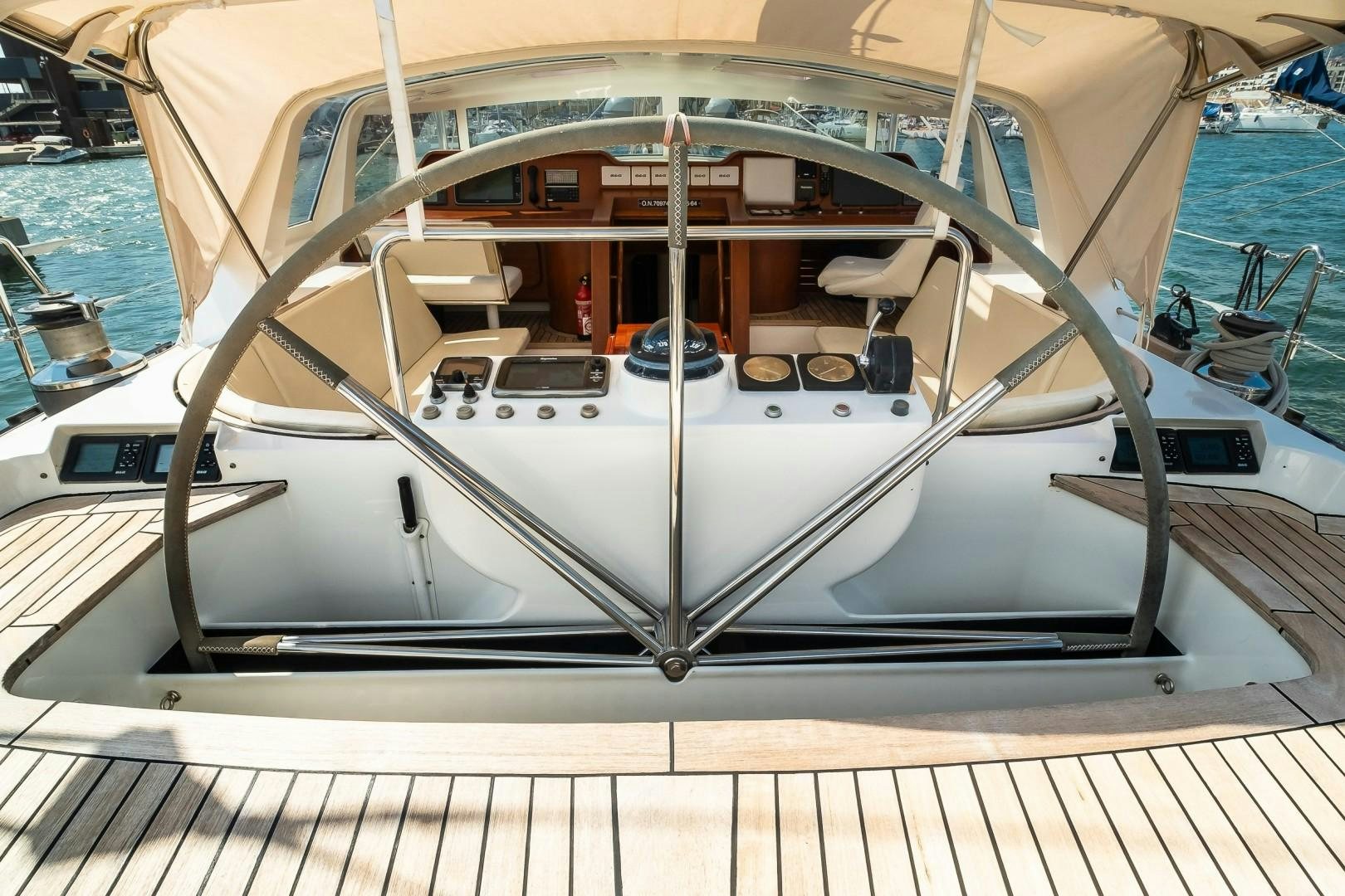 a white yacht on a dock aboard ARQUIMEDES Yacht for Sale