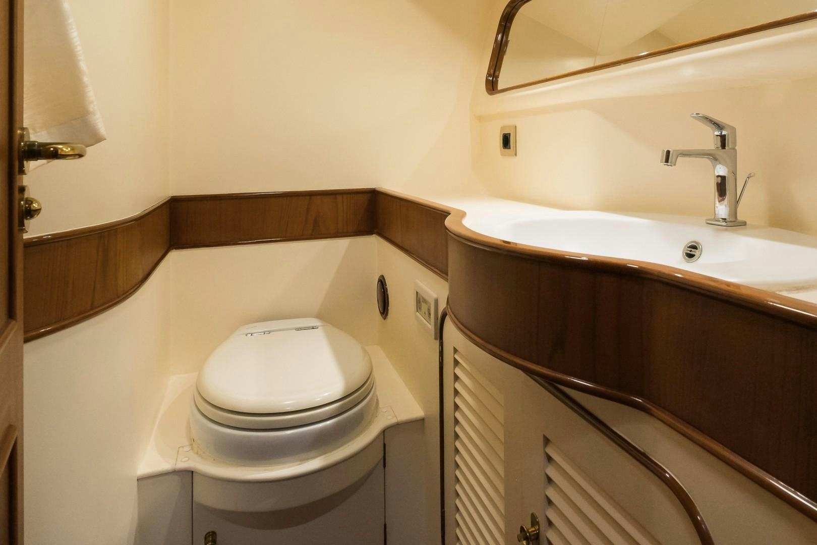 a bathroom with a toilet and sink aboard ARQUIMEDES Yacht for Sale
