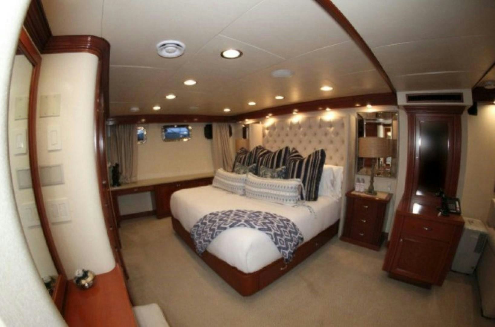 a bedroom with a large bed aboard HURACAN Yacht for Sale