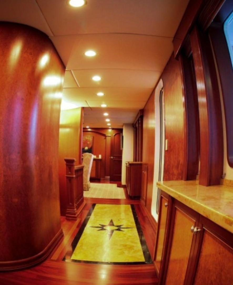 a hallway with a large red wall aboard HURACAN Yacht for Sale