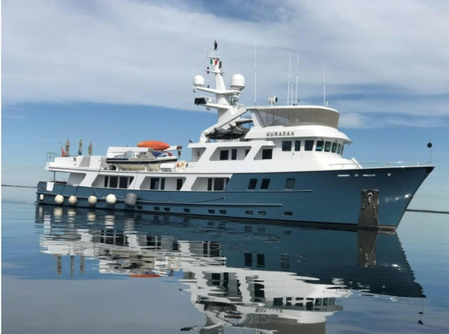 a large white boat aboard HURACAN Yacht for Sale