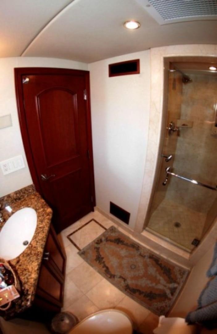 a bathroom with a sink and a shower aboard HURACAN Yacht for Sale