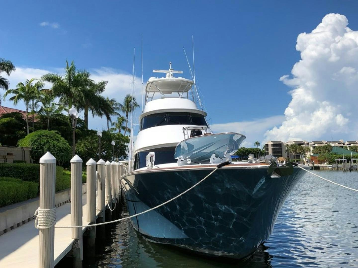 a boat docked at a pier aboard Renegade Yacht for Sale